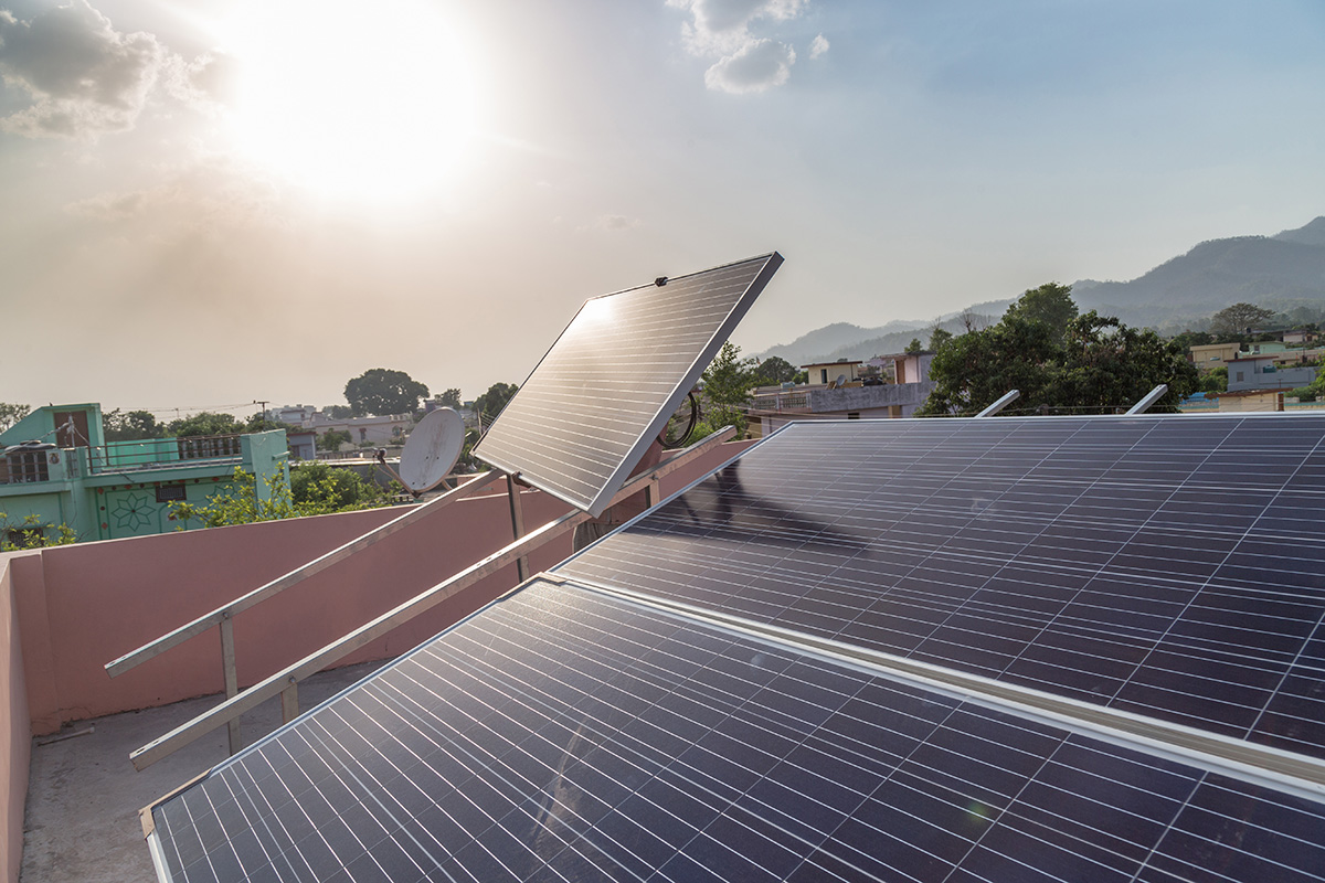 Solar Panels being installed on the roof of a multifamily affordable housing building.